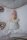 Minipüppchen sand mit pfirsichfarbener Mütze12 cm